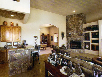 with handsome stonework, including the corner fireplace and wet bar